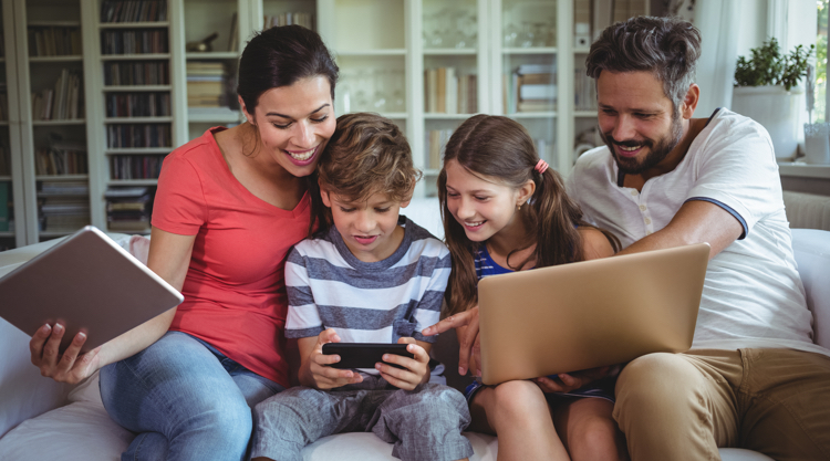 Family spending time together on multiple devices