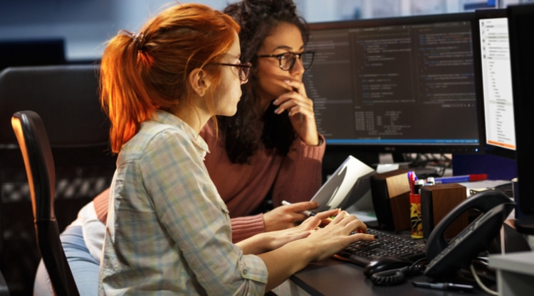 Two women looking at their computer screen