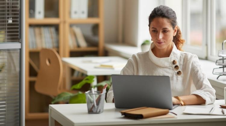 Successful Female Professional using Laptop at Home Office