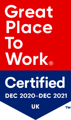 Red background with white text "Great Place To Work". A blue pentagon below it with white text "Certified Dec 2020- Dec 2021 USA"