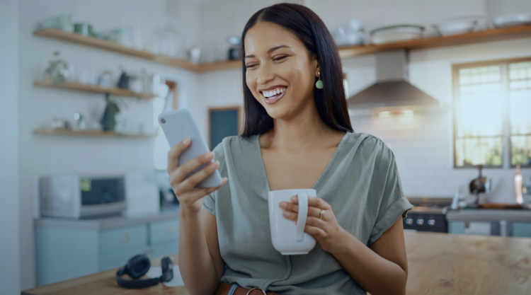 Smiling hispanic on social media and networking on a phone