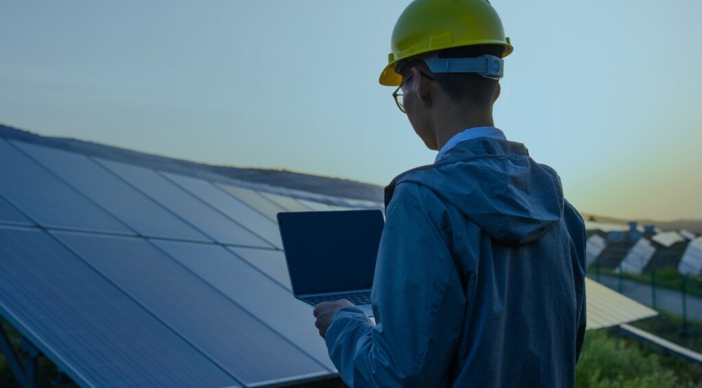 Engineer working with a laptop in solar power station