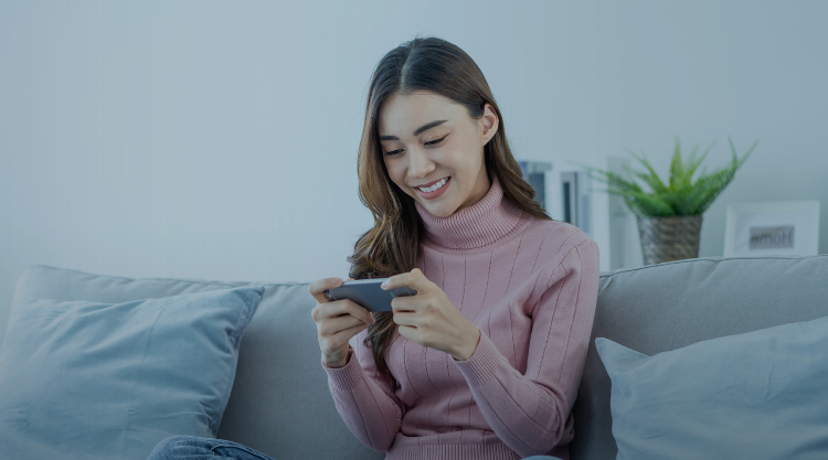 Woman on phone playing mobile game