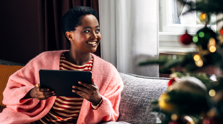 Woman Using A Tablet Device At Home