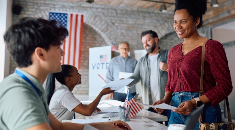 People wait in line to cast their ballots