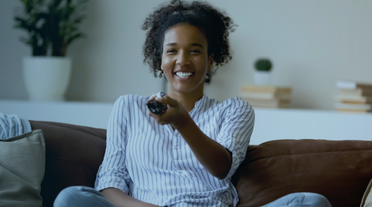 Woman at home watching TV