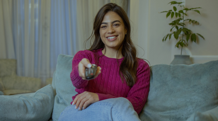 Woman watching tv at home