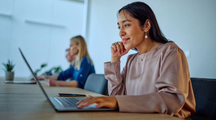 Woman working with ai agent on laptop