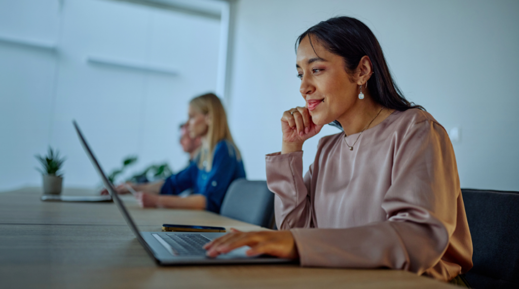 Woman working with ai agent on laptop