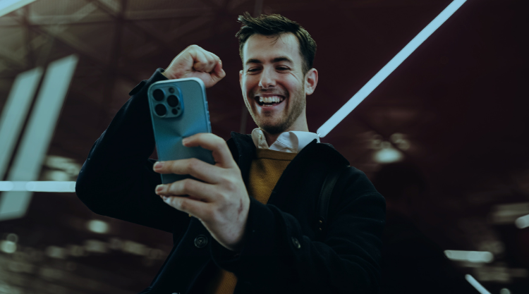 Person sports betting on phone