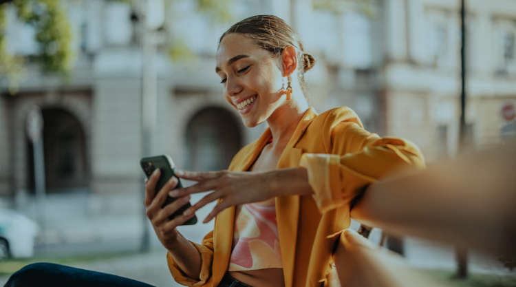 Woman outside holding phone
