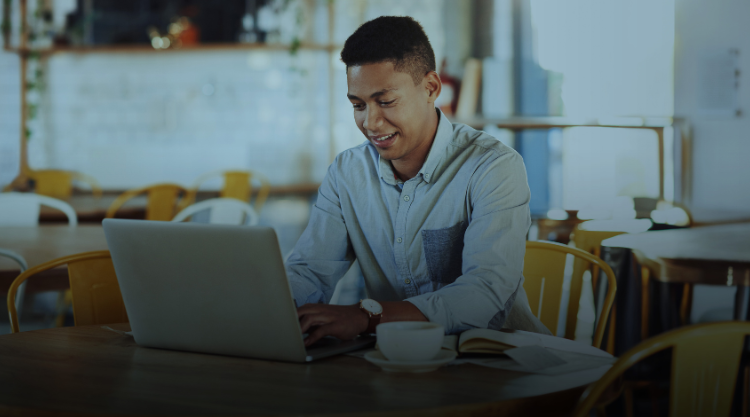 Man working on laptop at office